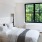 a bedroom with a large window